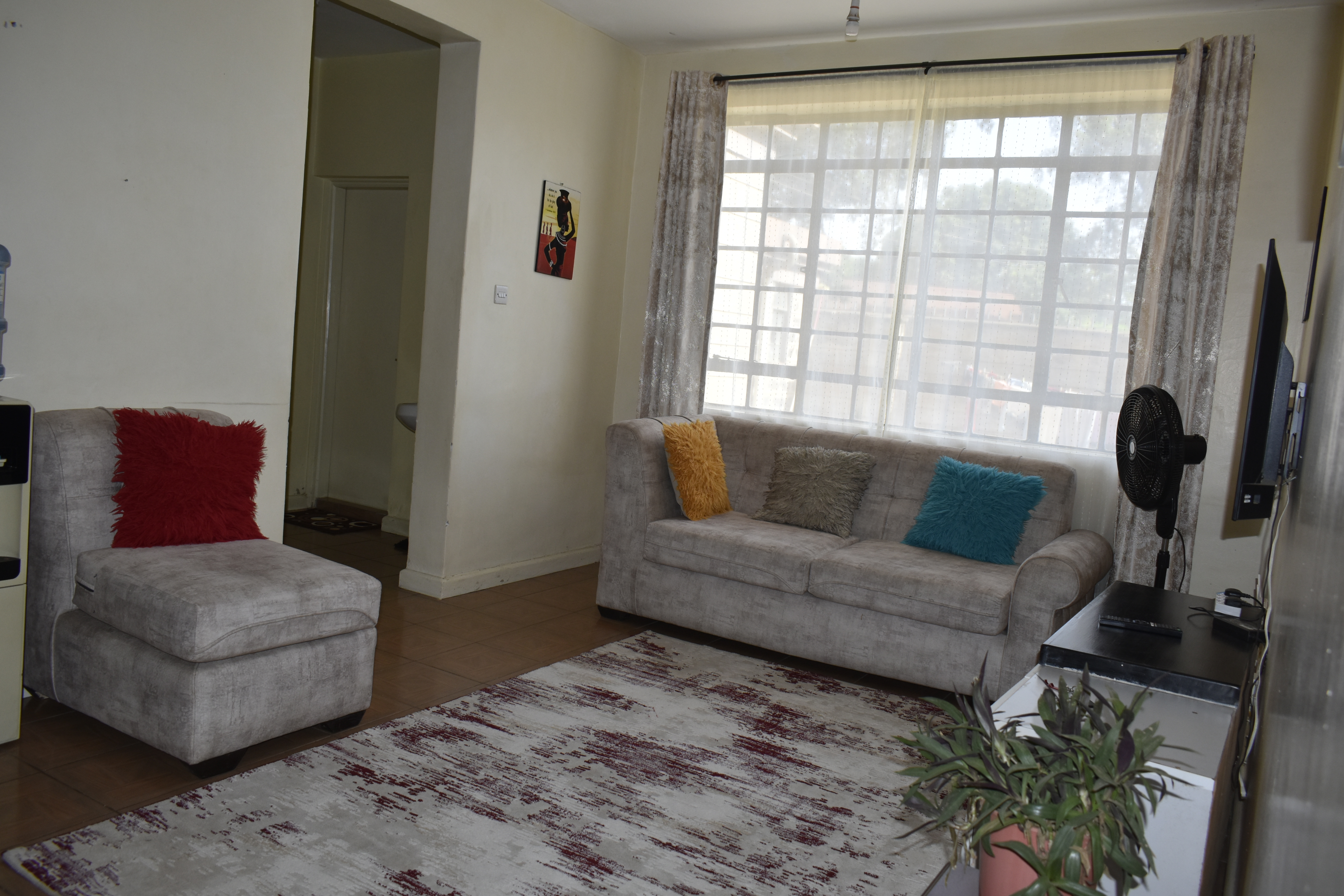 Premium furnished 2-bedroom Airbnb living room in Kisumu, Kakamega Road - NHC Homes